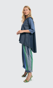 left side full body view of a woman wearing the alembika ocean stripes 4-pocket trousers.