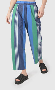 front bottom half view of a woman wearing the alembika ocean stripes 4-pocket trousers.