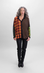 Load image into Gallery viewer, Front full body view of a woman wearing black pants and the alembika multi check blouse. This blouse has a mix of plaid and checkered prints on the front, a button up front, and dolman long sleeves.
