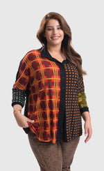 Load image into Gallery viewer, Front top half view of a woman wearing brown pants and the alembika multi check blouse. This blouse has a mix of plaid and checkered prints on the front, a button up front, and dolman long sleeves..
