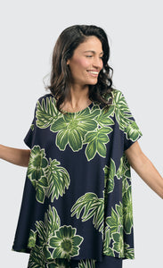 Front top half view of a woman wearing the alembika royal/green hula hi-lo swing top