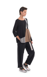 Load image into Gallery viewer, Front, left full body view of a woman wearing the alembika tekbika mixed print top. This top has 3/4 length sleeves and blocking of black and white stripes and mocha colored patches. On the bottom she is wearing a wide leg pant with a black and white striped patch.
