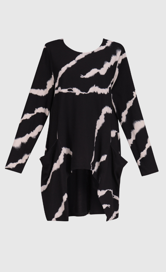 Front view of the alembika urban marble pocket top. This top is black with a white marbling print. The top has long sleeves, a round neck, and two front draped pockets.