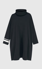 Load image into Gallery viewer, Front view of the alembika urban ribbon cowl neck tunic top in black. This tunic has deep side slits, a cowl neck, and long sleeves with two white stripes on the right arm.
