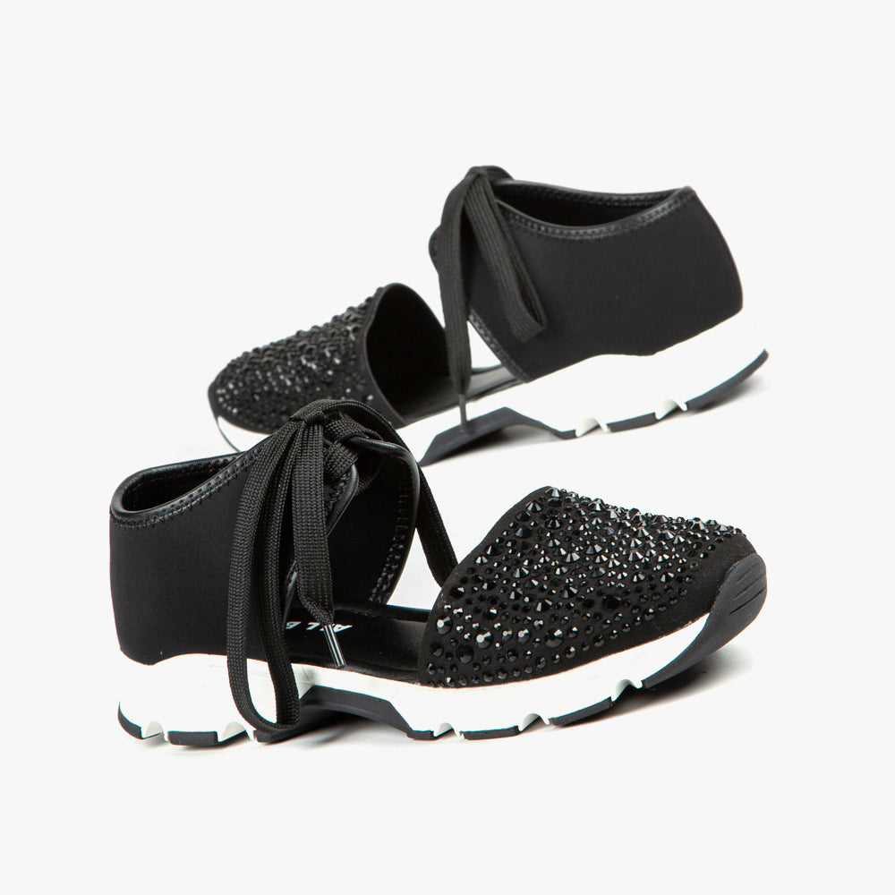 Outer side and inner side view of the All Black amazing gems sneaker sandal pair. This sneaker sandal has a lace up front separated from the toe upper. The upper on the toe is decorated with black rhinestones