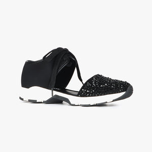 Outer side view of the All Black amazing gems sneaker sandal. This sneaker sandal has a lace up front separated from the toe upper. The upper on the toe is decorated with black rhinestones