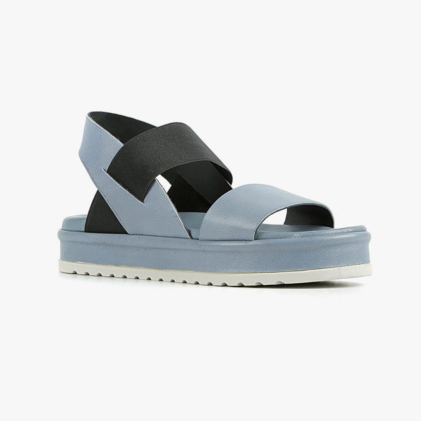 outer view of the all black banded trekker. This sandal has a strap over the toe bed and behind the heel with a black elastic strap over the instep. The rest of the shoe is a blue leather. 