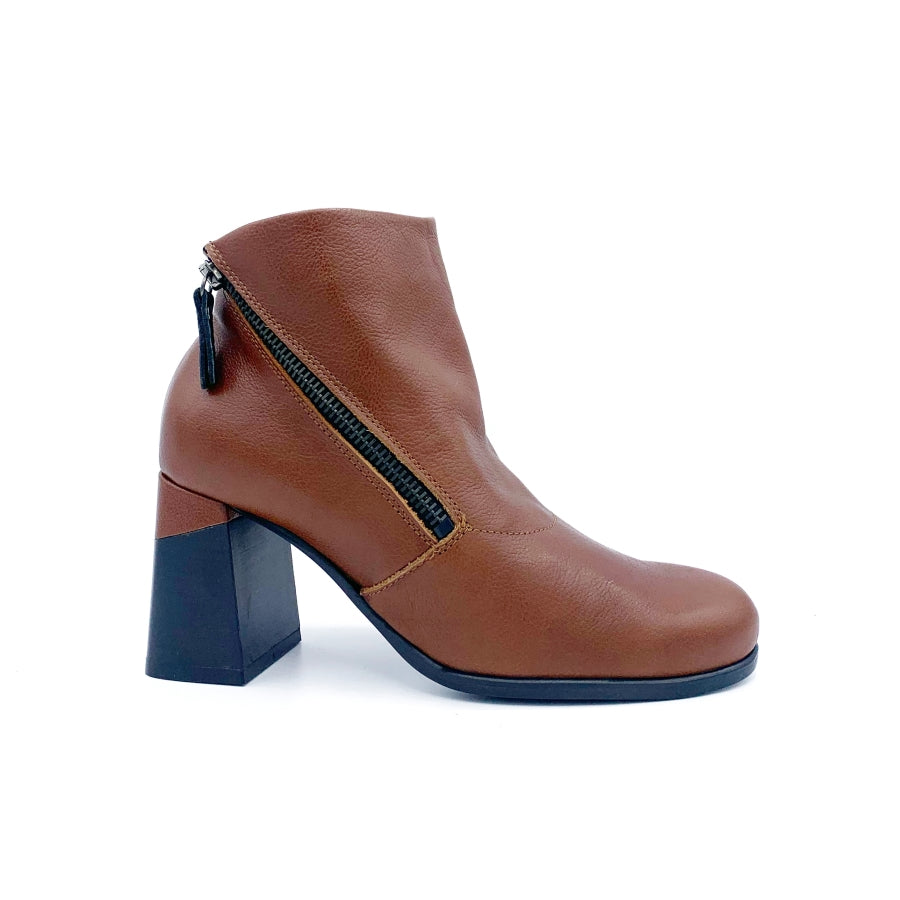 Outer side view of the all black double zip hi bootie. This bootie is brown/orange colored. It has a zipper on the outer side and the leather color covers up a portion of the mid-height chunky black heel.