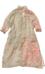 Load image into Gallery viewer, Back view of the banana blue bright flax splash print duster. This duster is flax/beige colored with pink and orange splatter paint print. This duster goes down to the knees, has long sleeves, a straight fit, and a short stand collar.

