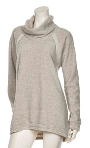 front view of the beate heymann fluffy sweatshirt. This sweatshirt is beige colored with a cowl neck, long sleeves, and an oversized fit.