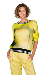Load image into Gallery viewer, Front top half view of a woman wearing the beate heymann batik lime top. 
