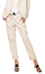 Load image into Gallery viewer, Front bottom half view of a woman wearing a beige top and the beate heymann roll up jacquard trouser. This pant is beige with a floral print. It has a roll up hem, and a beige elastic belt.
