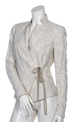 Load image into Gallery viewer, Front view of a mannequin wearing the beate heymann jacquard wrap jacket. This jacket is beige with a floral beige print and a tie on the left front side to close the jacket.
