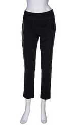 Load image into Gallery viewer, Front view of the beate heymann dotted pant. This pant is black with small white/grey dots on it. The pant has shiny black side striping and zipped side pockets. The bottom of the pants are cuffed.
