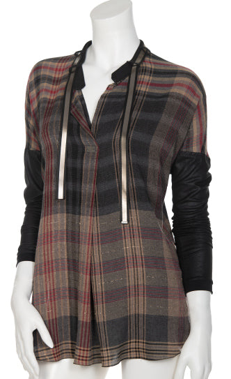 Front view  the beate heymann plaid blouse. This top is brown with a black and red plaid print. The top has a v-neck and black leather-looking drop shoulder long sleeves.