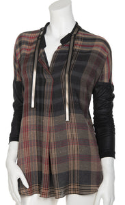 Front view  the beate heymann plaid blouse. This top is brown with a black and red plaid print. The top has a v-neck and black leather-looking drop shoulder long sleeves.