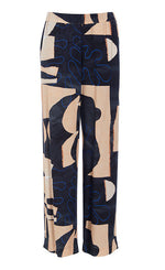 Load image into Gallery viewer, Front view of the bitte kai rand monstera pant. This pant is nude colored with a black and blue abstract pattern on it. The pants are wide legged.
