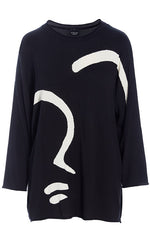 Load image into Gallery viewer, front view of the bitte kai rand bloom knit blouse with face. this top is black with a large white abstract sketch of a face on it. The top has long sleeves and a round neck. 
