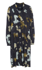 Load image into Gallery viewer, Front view of the bitte kai rand falling leaves dress. This dress is dark grey with mustard and light blue colored leaves all over. The dress is a button up with long sleeves and a seam at the waist.
