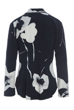 Load image into Gallery viewer, Back view of the bitte kai rand oki flower shirt. This shirt is black with large white flowers. It has long sleeves and a form-fitting silhouette.
