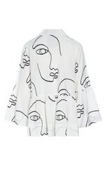 Load image into Gallery viewer, Back view of the bitte kai rand sketch viscose shirt jacket. This shirt is white with black sketch faces on it. It has long sleeves with ruffles and a ruffles on the bottom half of the top.
