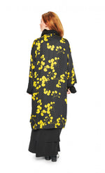 Load image into Gallery viewer, Back view of a woman wearing the bitte kai rand winter leaves kimono jacket. This long black jacket has yellow flowers/leaves and an off-center single front button.
