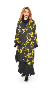 Front full body view of a woman wearing the bitte kai rand winter leaves kimono jacket. This long black jacket has yellow flowers/leaves and an off-center single front button.
