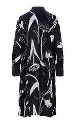 Load image into Gallery viewer, Back view of the bitte kai rand tulip tango shirt dress. This dress is black with black and white tulip flowers all over it. The dress has 3/4 length sleeves.
