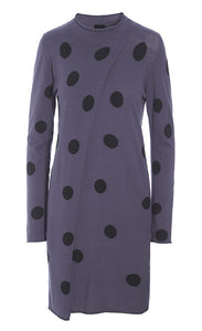 Front view of the bitte kai rand floret knit tunic with dots. This tunic is in the color blueberry with black dots. It has a wrapped feature in the front that closes at the neck. This tunic sits at the knees and has long sleeves.