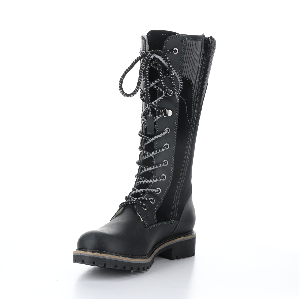 Inner front side view of the bos & co harrsion boot in the color black/grey. This boot is calf-height. It has a lace up front and panels of suede leather, burnished leather, and corduroy.  The inner side of this boot has a zipper.