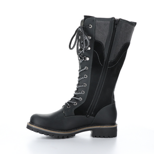 Inner side view of the bos & co harrsion boot in the color black/grey. This boot is calf-height. It has a lace up front and panels of suede leather, burnished leather, and corduroy.  The inner side of this boot has a zipper.