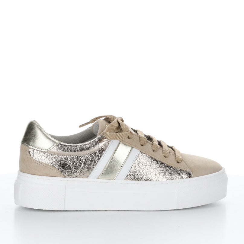 Outer side of the bos & co monic sneaker. This sneaker is beige with crinkled metallic sides, white and silver side stripes, a lace up front, and a platform sole.