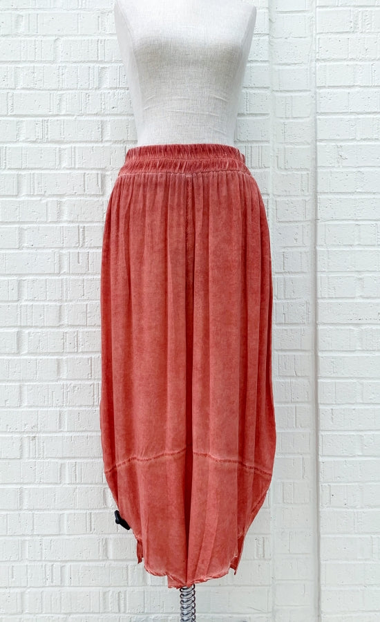 Front view of the crea concept coral pant. This pant has a wide leg with a tapered bottom and an elastic, scrunched waistband.