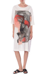 Load image into Gallery viewer, Front full body view of a woman wearing the Crea Concept Abstract T-Shirt Dress. This dress is white with 3/4 length sleeves, a round neck, and an abstract grey/orange print in the front.
