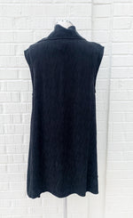 Load image into Gallery viewer, Back view of the crea concept black vest/top. This top is sleeveless with long solid back.
