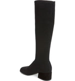 Load image into Gallery viewer, Inner back side view of the eileen fisher alas knit boot. This black boot comes up below the knee. It has a knitted fabric upper and a low block heel
