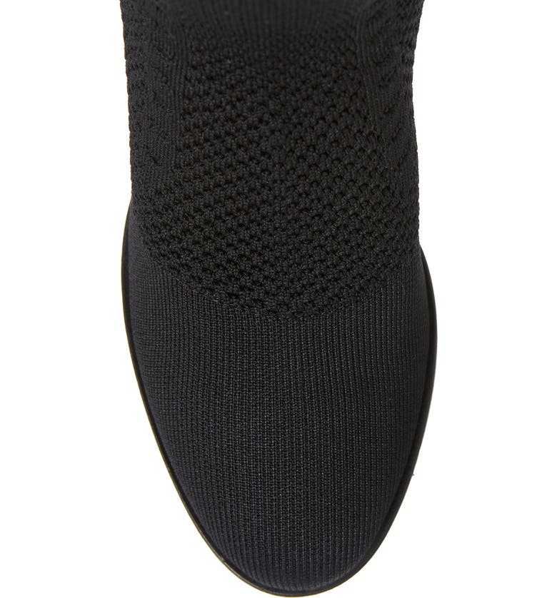 Birdseye close up view of the eileen fisher alas knit boot. This black boot has a knitted fabric upper and an almond toe