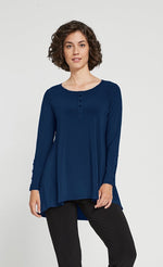 Load image into Gallery viewer, Front angle of woman wearing blue long sleeve icon henley top from Sympli
