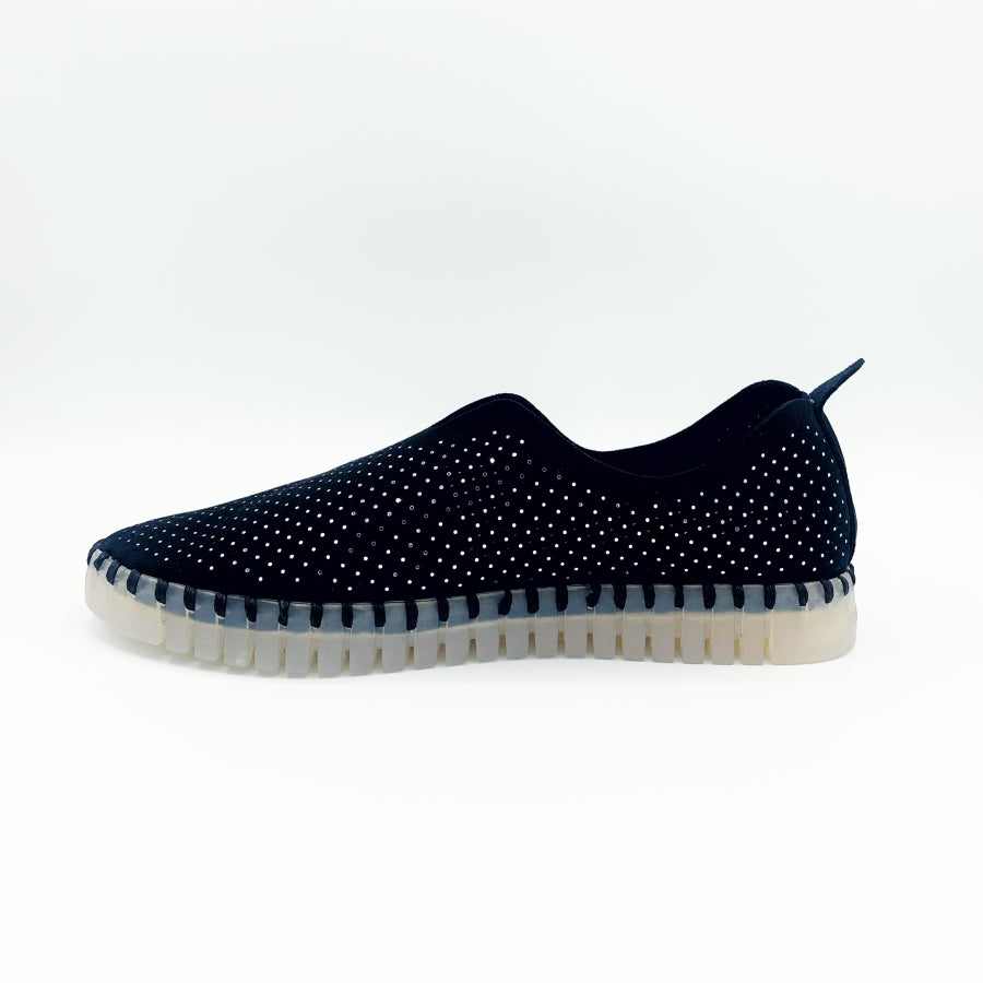 inner side view of the Ilse Jacobsen flat shoe in black. This shoe has a gummy sole. The upper features perforated holes and sparkles