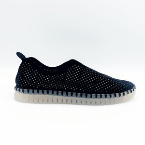 Outer side view of the Ilse Jacobsen flat shoe in black. This shoe has a gummy sole. The upper features perforated holes and sparkles