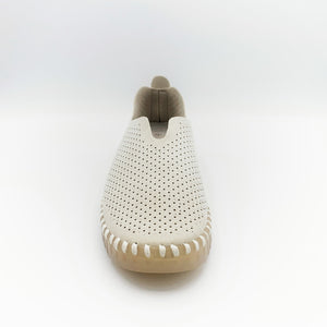 Front view of the Ilse Jacobsen flat shoe in creme. This shoe has a gummy sole. The upper features perforated holes and sparkles