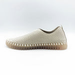 Load image into Gallery viewer, Inner side view of the Ilse Jacobsen flat shoe in creme. This shoe has a gummy sole. The upper features perforated holes and sparkles

