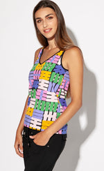 Load image into Gallery viewer, Front top half view of a woman wearing the indies belem tank top. This tank top has a v-neck and features a hashtag print made of purple, orange, green, and pink hashtags. The hem has black trim. 
