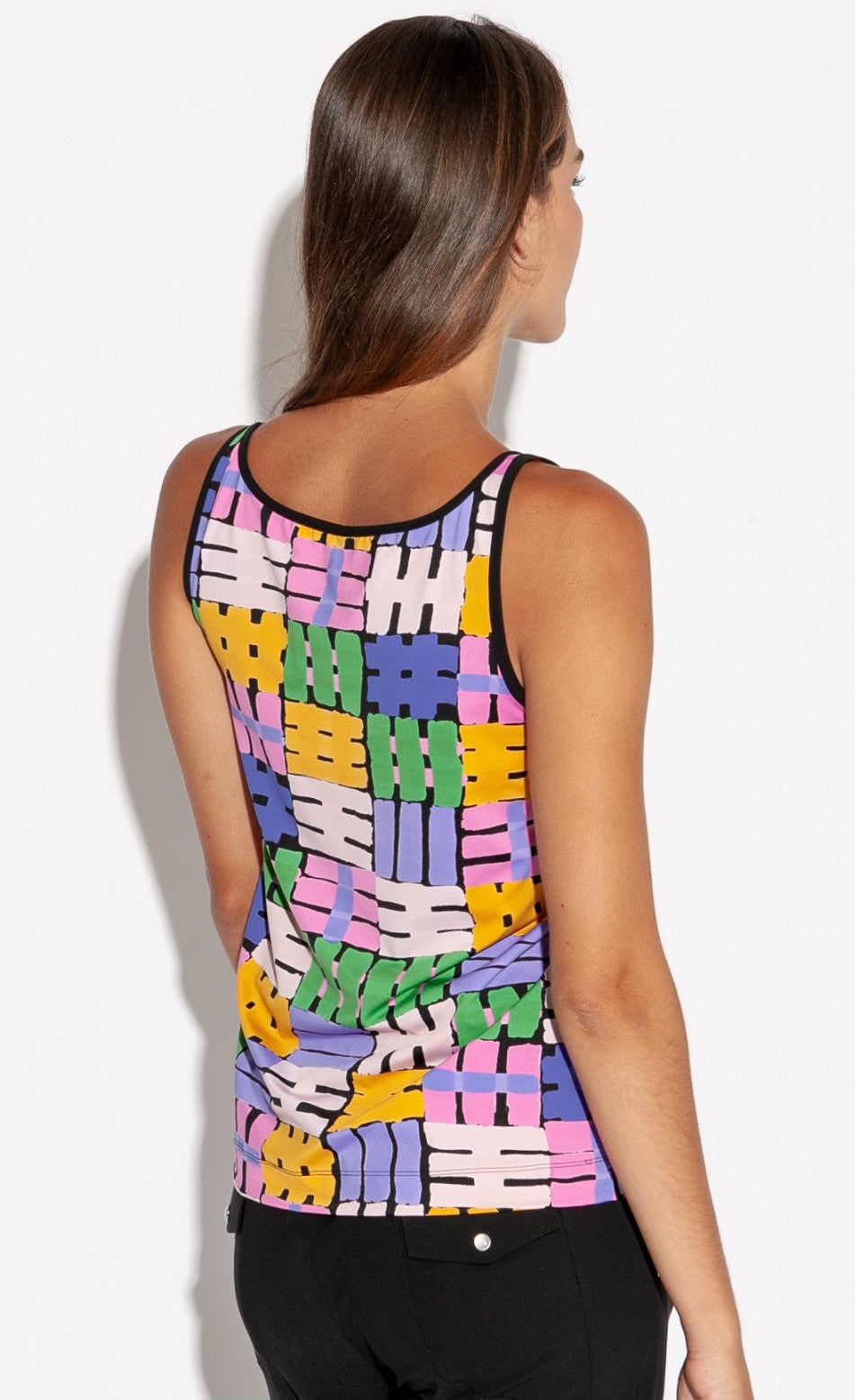 Back top half view of a woman wearing the indies belem tank top. This tank top features a hashtag print made of purple, orange, green, and pink hashtags. The tank also features black trim around the neck and straps. 
