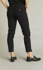 Load image into Gallery viewer, Back bottom half view of a woman wearing the black indies epatant pants. These pants have two flap back pockets.
