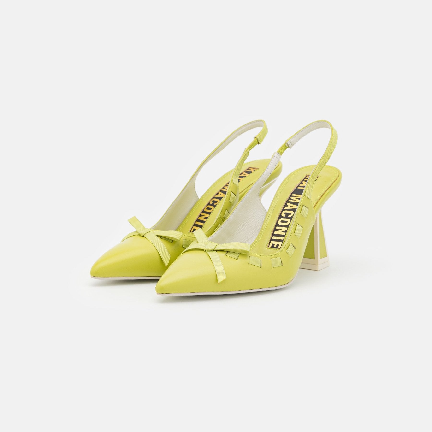 outer side view of a pair of the kat maconie Kacy high heel in the color celery.