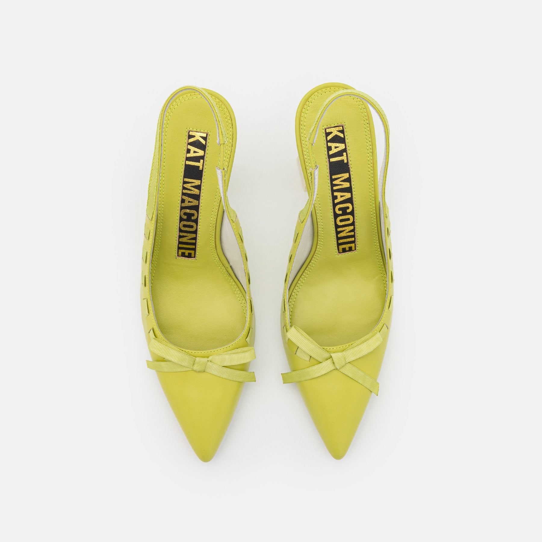 birdseye view of a pair of the kat maconie Kacy high heel in the color celery.