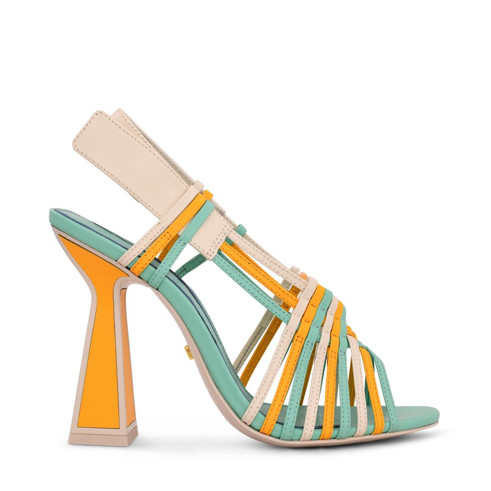 Outer side view of the kat maconie sheri sandal. This strappy sandal has a high heel and a mix of turquoise, yellow, and white colored straps. The white back strap is wider and adjustable. The heel is yellow and outlined with opal/white.