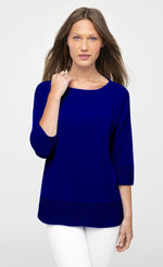 Load image into Gallery viewer, Front view of a woman wearing the royal blue easy rib pullover sweater top from Kinross. This top has 3/4 length sleeves and ribbed detailing on the bottom of the sleeves and bottom of the top.

