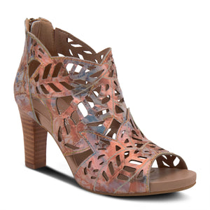 Outer side front view of the l'artiste amora pump. This high heel sandal has a bronze/pink color with hints of blue. The sandal has a laser cut upper that looks like many leaves coming together. The shoe is also open toe.
